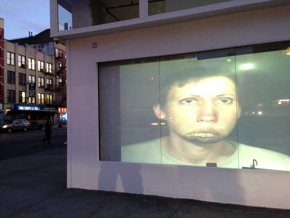 Video portrait projected onto a storefront
