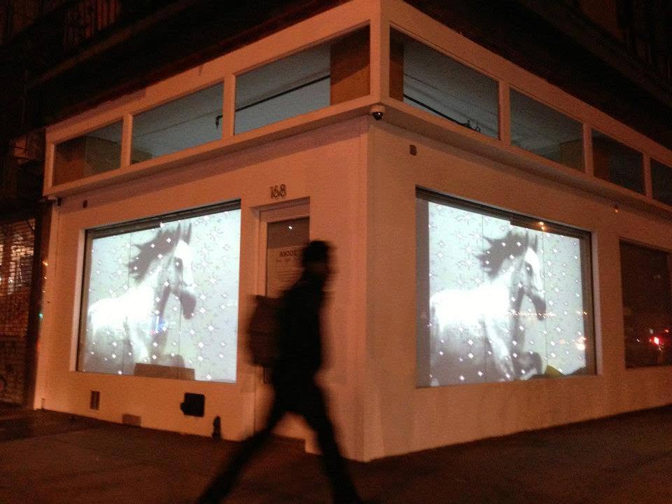 Passer-by in front of a video installation